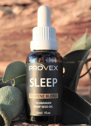 A bottle of Provex Sleep Enhanced Hemp Seed Oil with a dropper, set against a natural background with greenery.